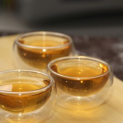 Green tea in glass small piala cup on table