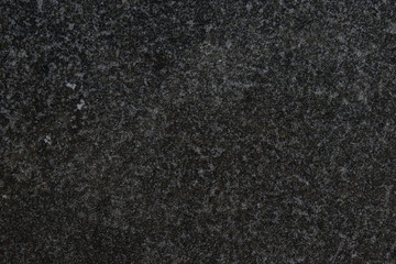 Asphalt pavement covered with snow in winter.