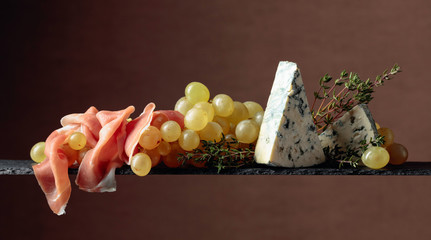 Grapes with blue cheese, prosciutto and thyme.