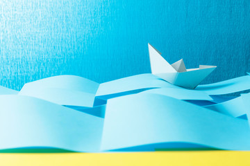 Paper ship in the paper sea. Concept of the theme of bureaucracy.