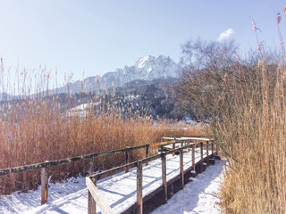 wooden bridge over the river in winter , mountain switzerland