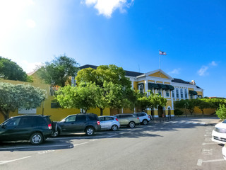 Fototapeta na wymiar Willemstad, Curacao, Netherlands - coloured buildings on street in Curacao