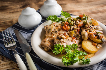 Fillet of chicken legs with stewed vegetables.