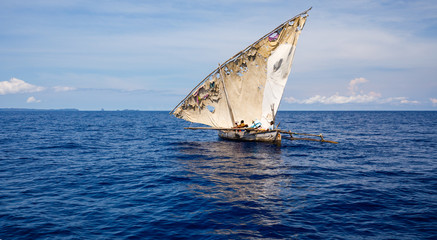 Patched sail on a pirogue of native fishermen in Nosy Be, Madagascar