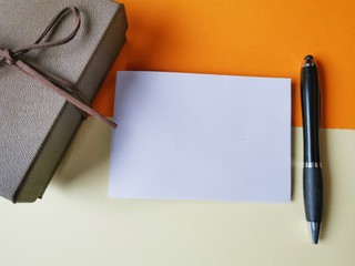 notebook, pen, on table background.  top view copy space