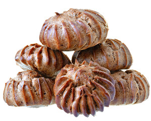 Heap of freshly baked brown eclairs isolated