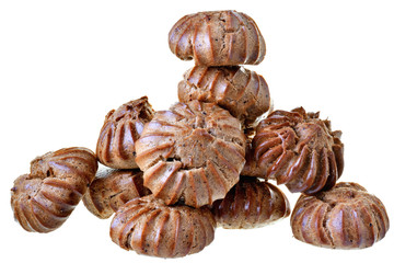 Heap of freshly baked brown eclairs isolated