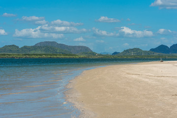 Long white sandy beaches in the north side of the island of Ko Lanta Yai. The north side of the island includes a protected area, the Mu Ko Lanta National Park and a many mangrove forest