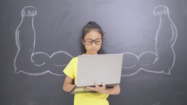 Student using a laptop with drawn of strong hands