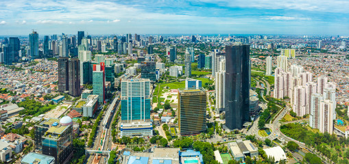 Jakarta, Indonesia - CIRCA 2018: Aerial view of Jakarta's Central Business District at a sunny morning. Sunlight falls on the building.