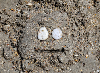 Smiling sand rock face