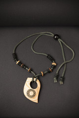 Fototapeta na wymiar handmade necklaces on a black background