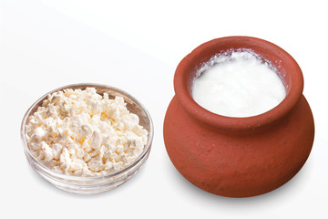 Desi Makhan, Fresh cottage cheese in a bowl with spoon & buttermilk on a white background. - image.