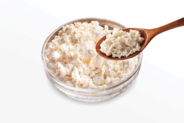 Desi Makhan, Fresh cottage cheese in a bowl with spoon & buttermilk on a white background. - image.
