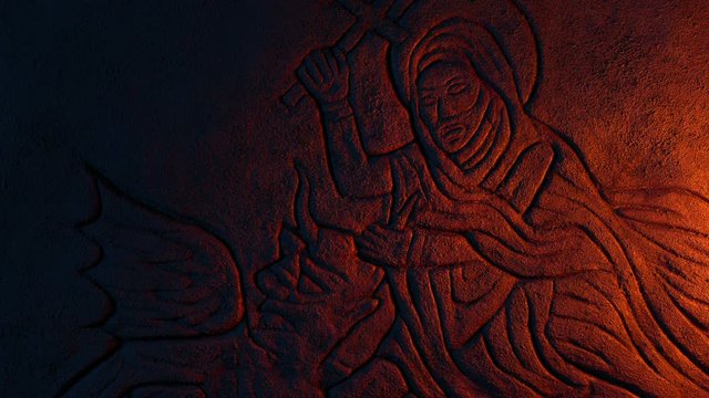 Man Wrestling Devil Ancient Carving Is Lit Up