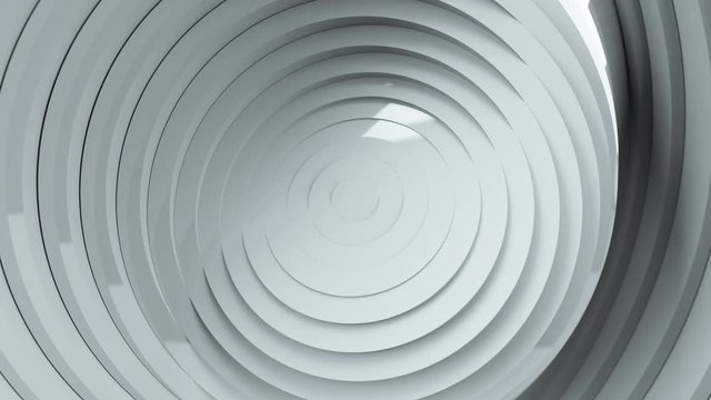 Abstract pattern of circles with the effect of displacement and rotation. White clean rings animation. Reflective surface. Abstract background for business presentation. Seamless loop 4k 3d render