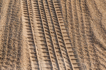 Tire track of wet sand