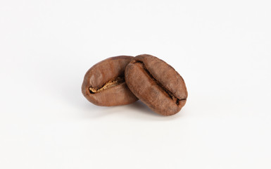 Obraz premium Coffee beans on white background, high resolution, macro.
