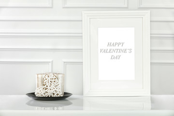 White wooden table with white wall background and free space for your decoration.White wooden frame and copy space of Valentine's Day 