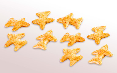 Fried and Spicy Aero Plane Snacks or Fryums (Snacks Pellets) served in a bowl or White background. selective focus - Image