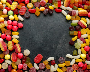 A lot of colorful candy on background, texture