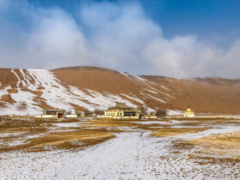 Yellow sand and white snow, and beautiful sky in Badain Jaran Desert, Inner Mongolia, China