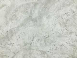 A gray concrete background with texured, wallpaper