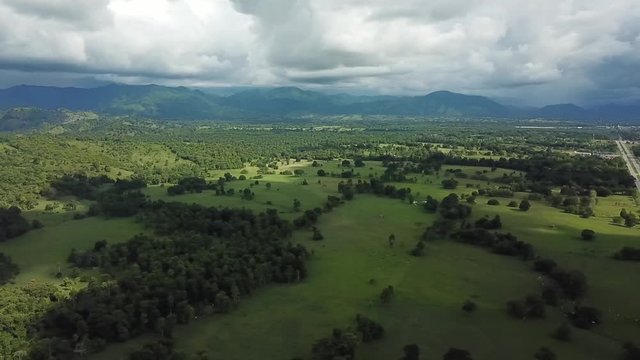 Aerial drone shot of a landscapes of fields and clouds in Colombia