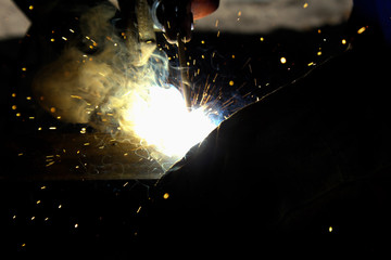 metal work welding arc and sparks along with smoke
