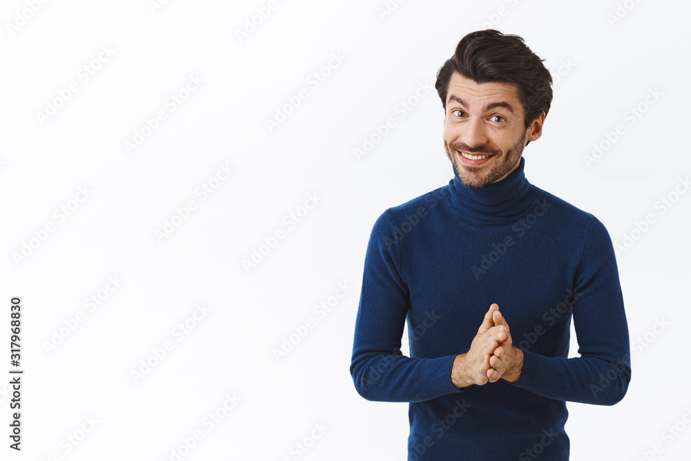 Wall mural handsome successful male entrepreneur in blue high neck sweater, rubbing hands and smiling joyfully, - Wall murals
