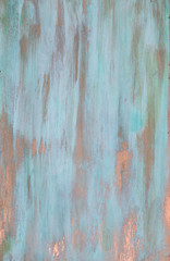 The texture of the copper background is covered with a patina