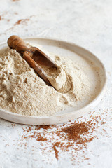 Teff flour in a plate with a spoon