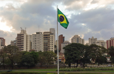 Brazilian flag and buildings of sao paulo city, at independence park