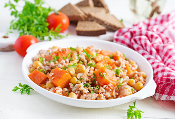 Chili con carne of turkey  with chickpeasand pumpkin on white wooden table.  Chili with meat. Mexican / Texas traditional food.