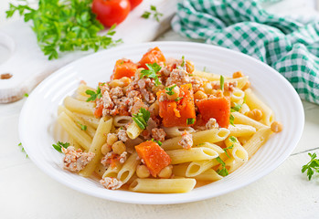 Italian pasta, penne with minced meat, chickpeas and pumpkin. Healthy food. Pasta with forcemeat.