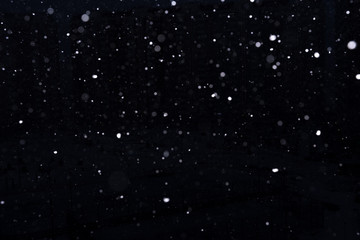 snow on a black background. snow texture