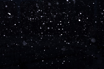 snow on a black background. snow texture