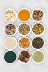 Herbs and spice used in chinese herbal medicine to treat irritable bowel syndrome with dietary supplement powders. Flat lay. 