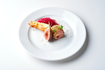 Pate with fig and toast. Set Food Menu On A White Plate. Top view of light dish perfect served. 