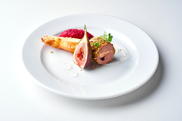 Pate with fig and toast. Set Food Menu On A White Plate. Top view of light dish perfect served. 