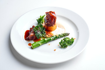 Meat and asparagus. Set Food Menu On A White Plate. Top view of light dish perfect served. 