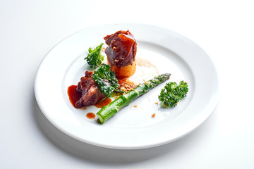 Meat and asparagus. Set Food Menu On A White Plate. Top view of light dish perfect served. 