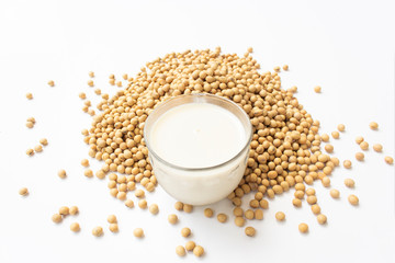 Top view of mung bean milk on a spoon on a white background