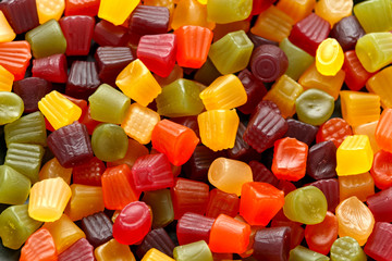 A mix of Midget Gems candy background, texture. sweet food