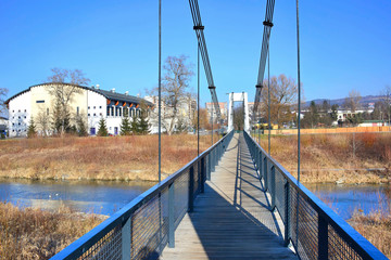Pedestrian suspension bridge over the Kamienica river, Nowy Sacz, Poland © Jurek Adamski