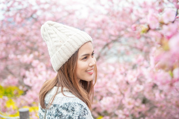 Attractive woman is enjoying  with  Cherry Blossom in Matsuda , Japan