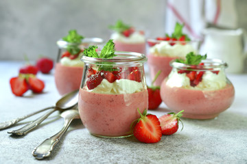 Delicious strawberry mousse with fresh berries and whiped cream.