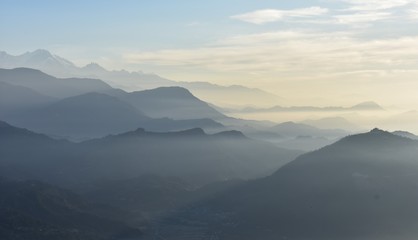 Fototapeta na wymiar mountains range in fog winter season sarankot nepal