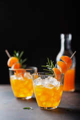 Alcoholic cocktail with mandarins