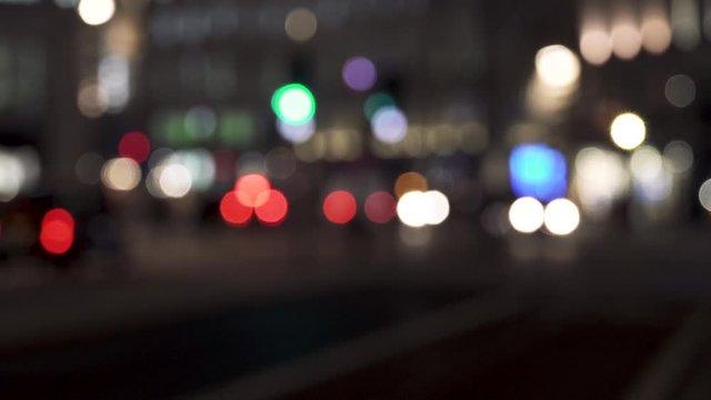 Blurred Defocused Lights of cars on a City Road at Night. London, UK.